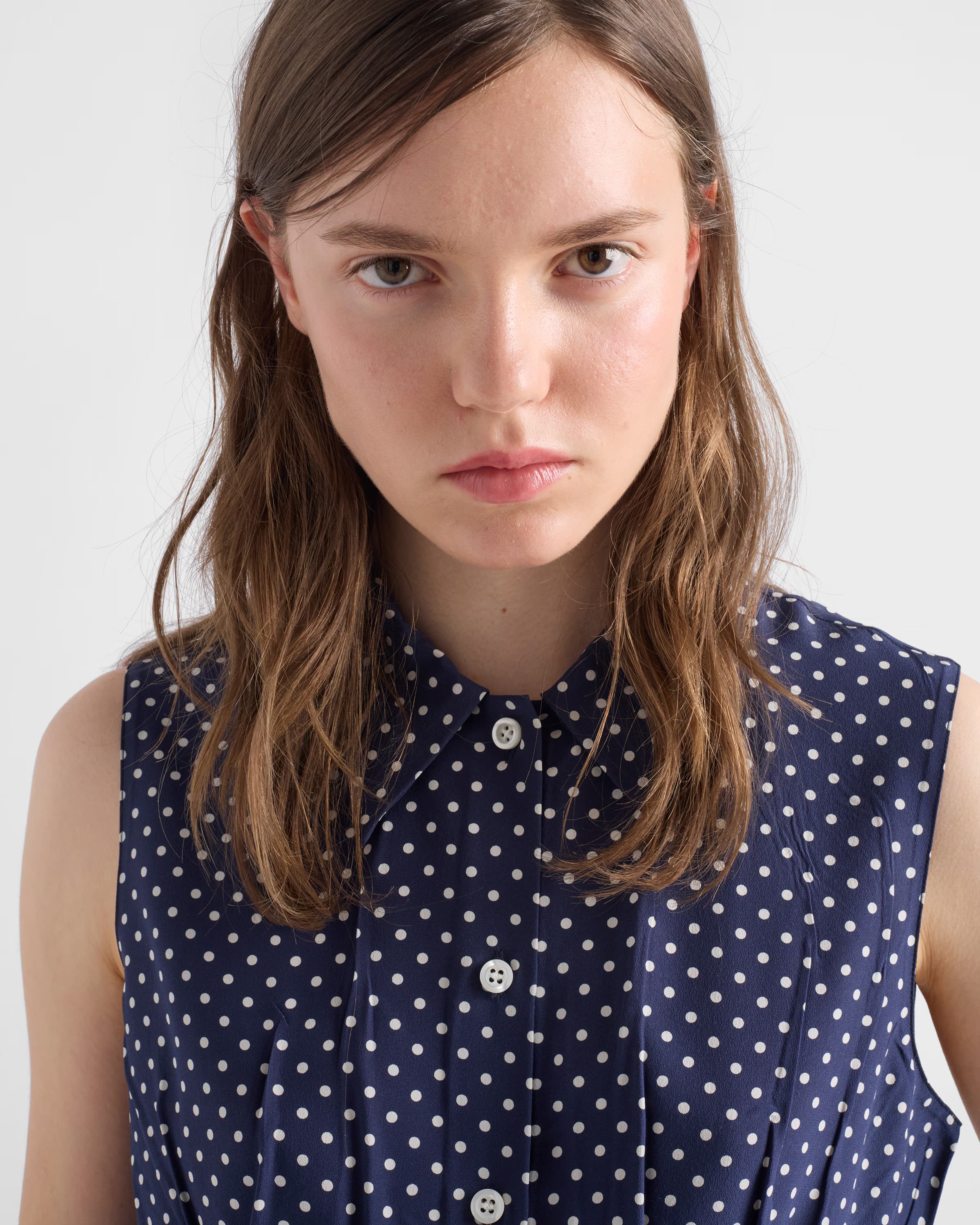 Sleeveless polka-dot marocain silk shirt